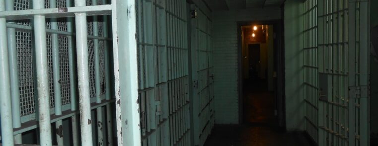 Photograph of a prison hall styled dramatically to emphasise the horror