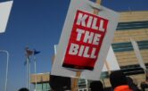 Protest sign that says "kill the bill"