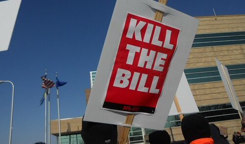 Protest sign that says "kill the bill"