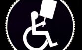 Graphic of a person in a wheelchair holding a blank protest sign